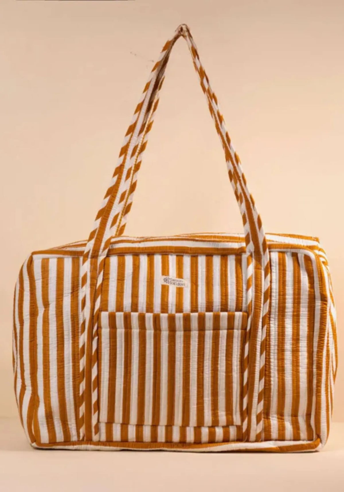 Le sac week-end ou à langer rayé moka de chez Maison Horizon 